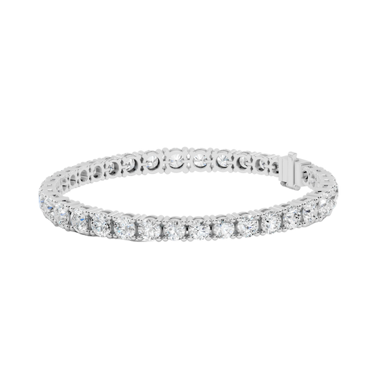 Silver bracelet with clear stones on a white background